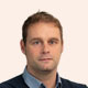 Official photograph of Marc Ó Cathasaigh